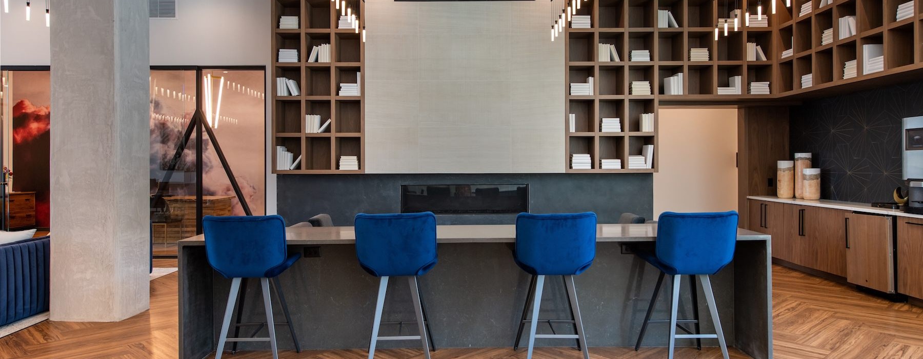 a room with blue chairs and shelves