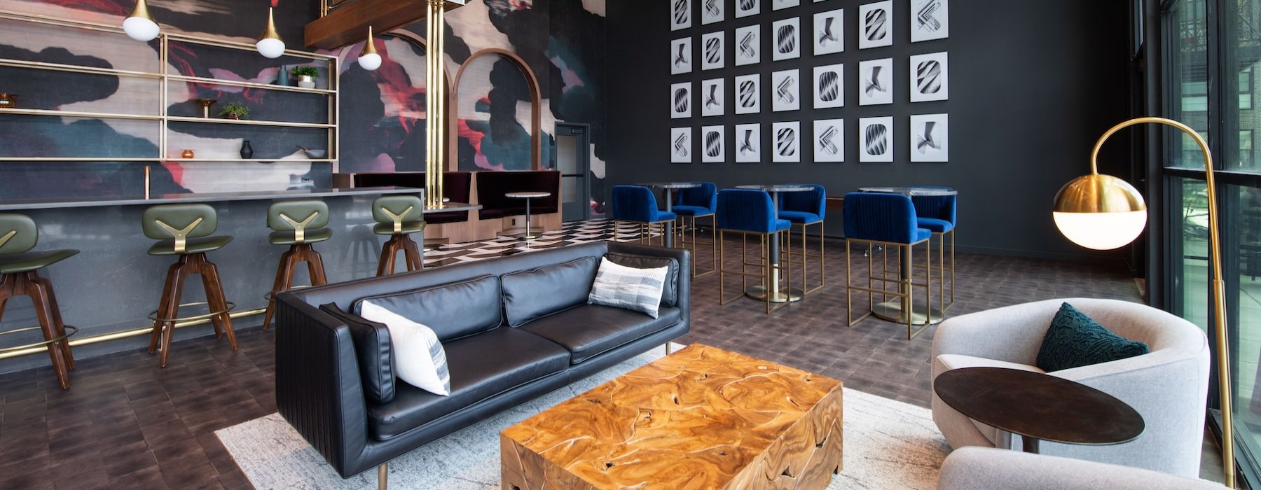 a room with a couch and chairs