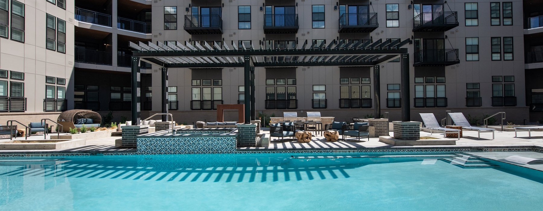 a pool in front of a building